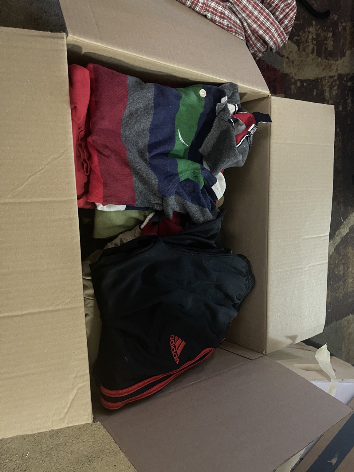 A variety of clothing packed for the September giveaway.
