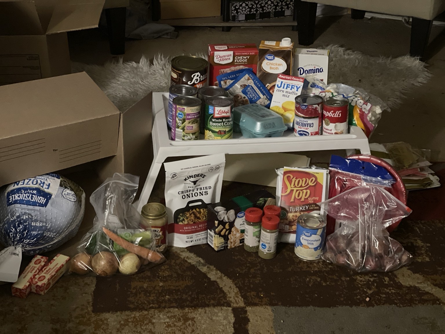 Turkey, vegetables, and pantry ingredients gathered for meal kits.